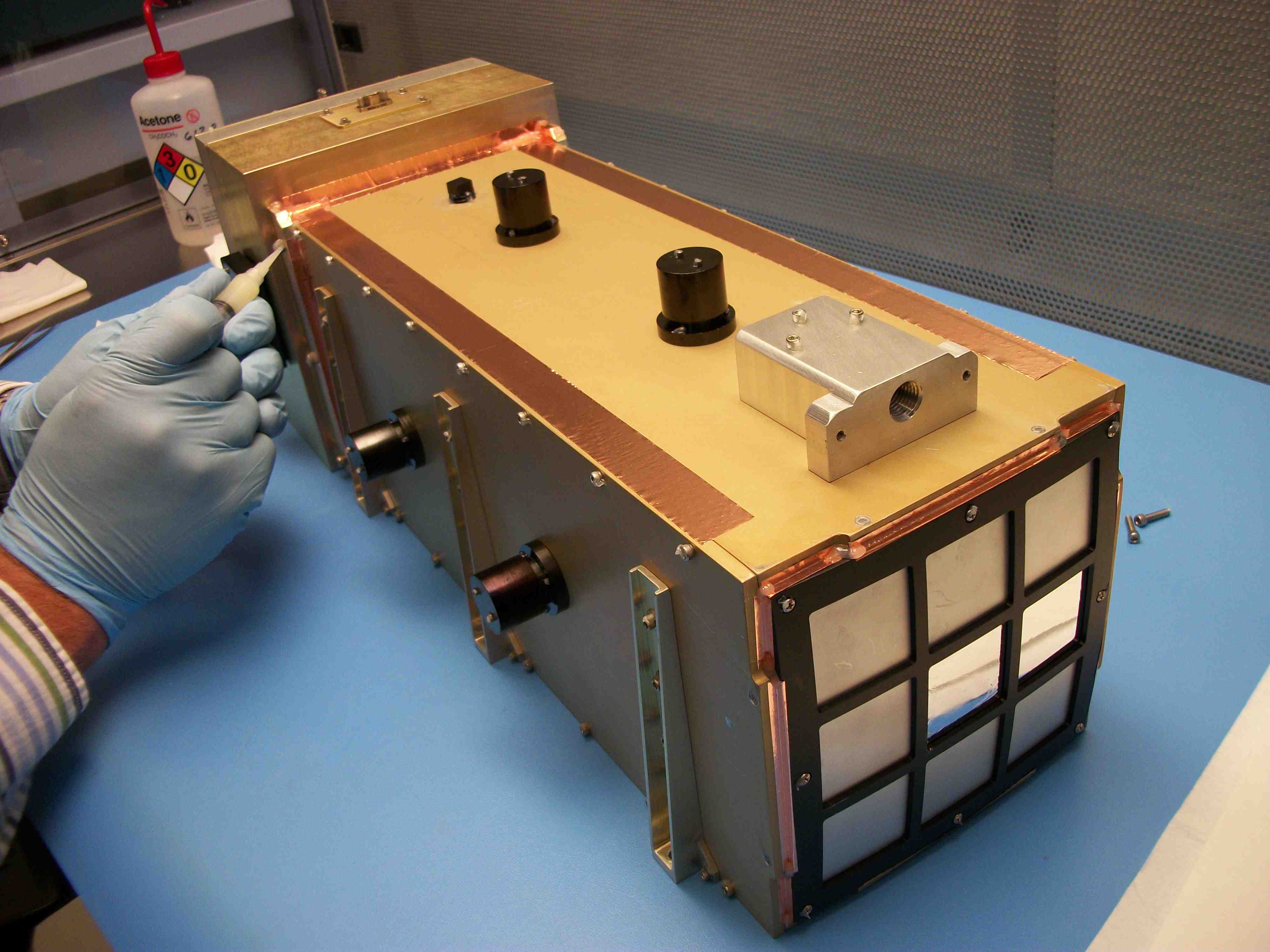 The integrated instrument prototype with the optics assembly at the front and the electronics box in the back. Credit-NASA The integrated instrument prototype with the optics assembly at the front and the electronics box in the back. Credit-NASA