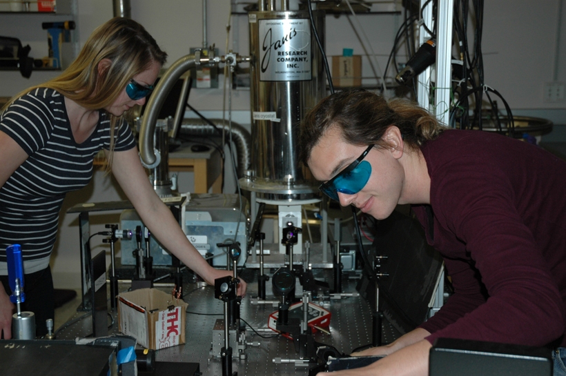 Erica Calman and Chelsey Dorow align optics required to collect measurements from a molybdenum disulfide sample. <br/>CREDIT: Calman Erica Calman and Chelsey Dorow align optics required to collect measurements from a molybdenum disulfide sample.
