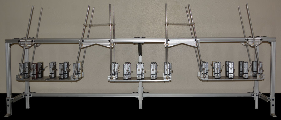 The experimental system consists of three swings connected by springs and holding up to 15 metronomes each. Adjacent metronomes and swings transfer momentum to one another, and adjacent swings transfer momentum through the springs. With the right metronome frequency and spring strength, complex global behavior such as the chimera state can emerge.