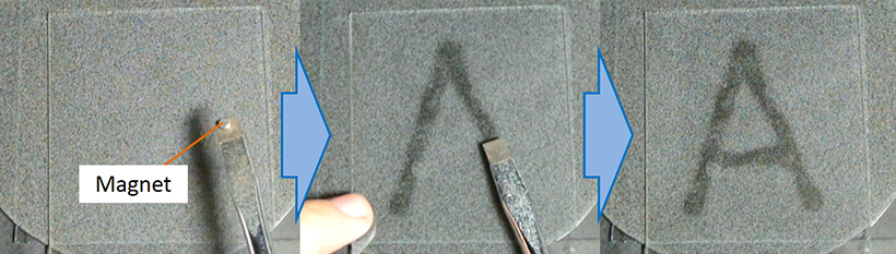 Handwriting with a magnet is demonstrated on a prototype of the new e-paper. <br/>CREDIT: Yusuke Komazaki/ University of Tokyo Handwriting with a magnet is demonstrated on a prototype of the new e-paper. Credit -- Yusuke Komazaki/ University of Tokyo