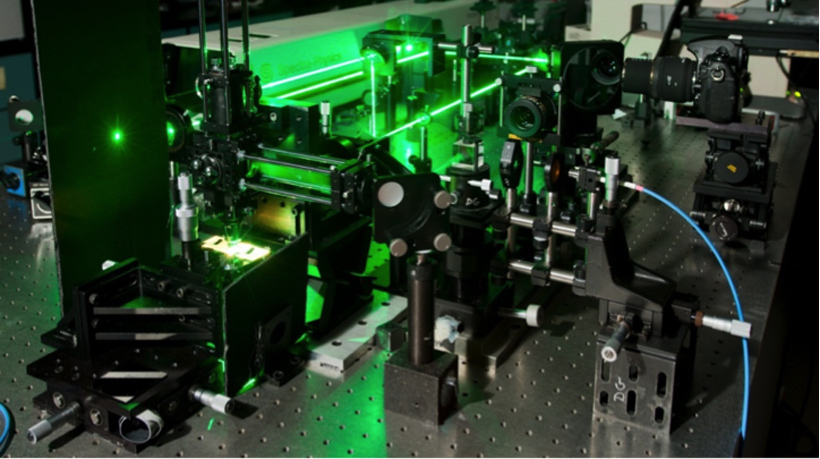 This image shows the experimental set-up researchers used to analyze the behavior of quantum dots placed on metal oxides. A laser illuminated the quantum dots to make them glow and a spectrometer was used to analyze the light they emitted. <br/>CREDIT: Seyed Sadeghi/ University of Alabama, Huntsville Analyzing quantum dots