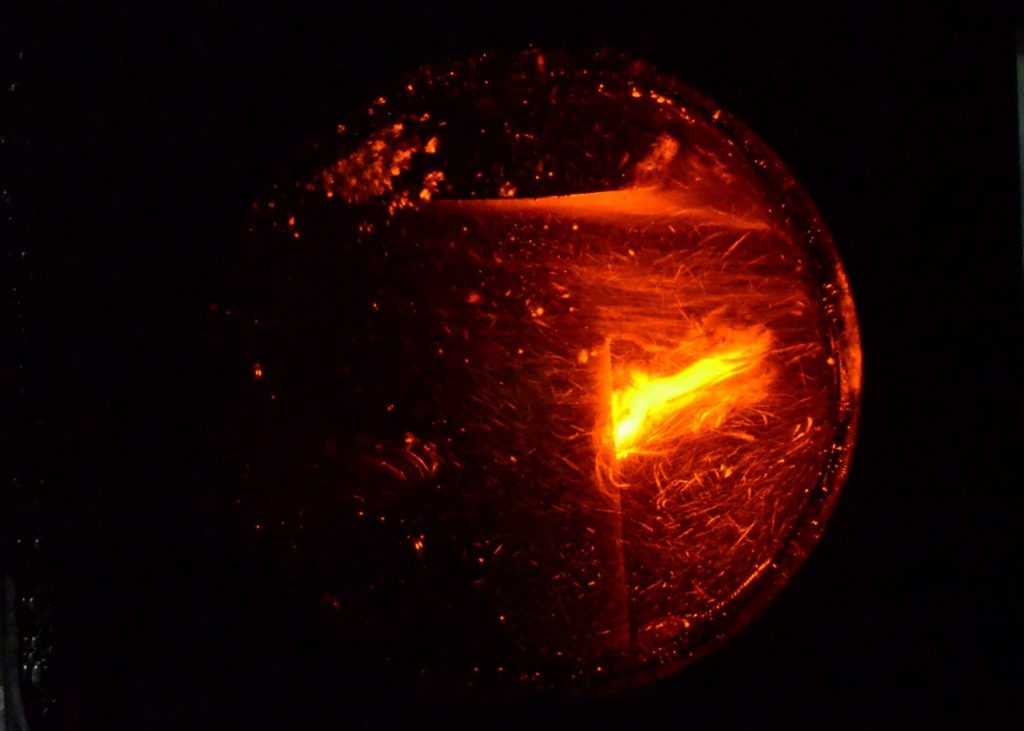 The plasma chamber in the experimental reactor setup, where 2-kilowatt microwave pulses are applied to a model stand-in for biomass, a recirculating carboxymethyl cellulose solution. Plasma induction in the material resulted in reduced viscosity, and the authors suspect it may break the polymer chain in lignocellulose. CREDIT: B. Honnorat, V. Brüser, and J.F. Kolb.