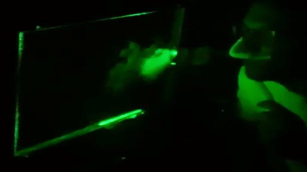 A test subject coughs into a laser scanner during a University of Amsterdam study on how microdroplets spread the virus that leads to COVID-19. CREDIT: University of Amsterdam