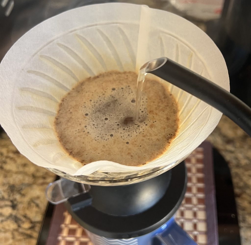 Pour-over coffee is made by flowing a strong, laminar water jet through a bed of ground coffee beans. Credit: Ernest Park