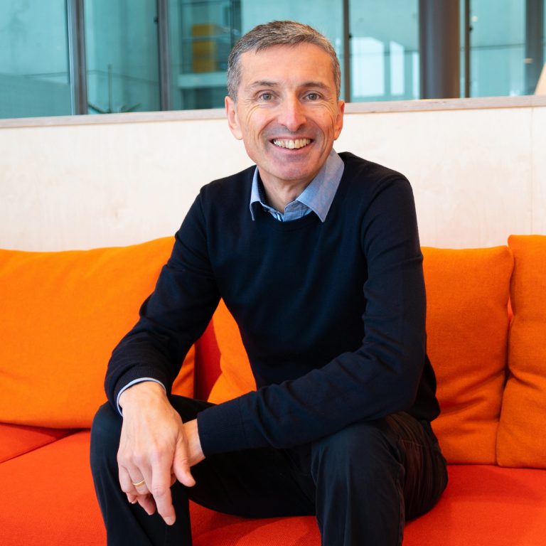 Image of Gerhard Hummer sitting on a couch